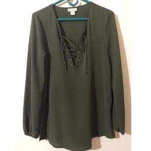 Misses Long sleeve crepe top with grommet tie front.